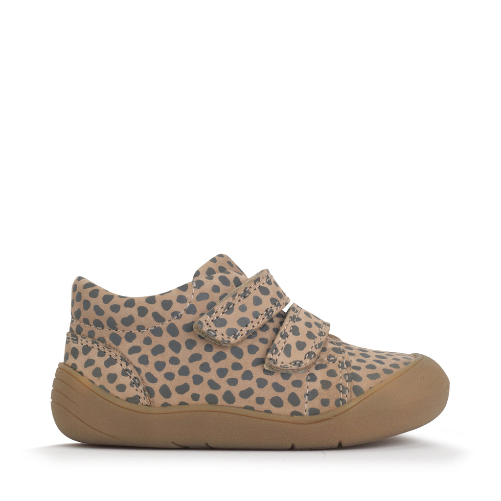 Beige shoe with a pattern on a white background